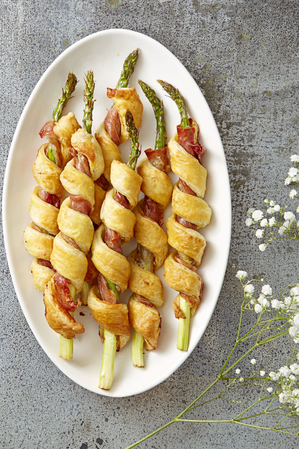 <p>There is a vegetable inside each one, for a (secretly) healthy version of the Super Bowl staple. </p><p>Get the <a href="https://www.goodhousekeeping.com/food-recipes/a38354/sprigs-in-a-blanket-recipe/" rel="nofollow noopener" target="_blank" data-ylk="slk:Sprigs in a Blanket recipe;elm:context_link;itc:0;sec:content-canvas" class="link "><strong>Sprigs in a Blanket recipe</strong></a>. </p>