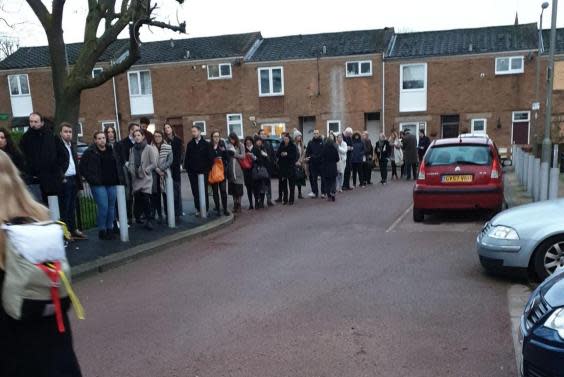 (PA) Voters queue up in Balham, London, to cast their ballots