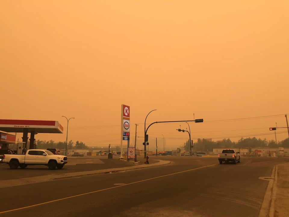 Smoky conditions in Yellowknife on Sunday. As of Tuesday morning, the Behchoko-Yellowknife fire was about 20 kilometres from the capital with 'significant fire behaviour' expected through the day. (Luke Carroll/CBC - image credit)