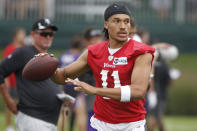 Minnesota Vikings quarterback Kellen Mond looks to throw the ball during NFL football training camp Wednesday, July 28, 2021, in Eagan, Minn. (AP Photo/Bruce Kluckhohn)