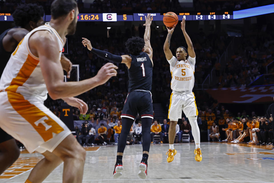 Tennessee guard Zakai Zeigler (5) shoots over South Carolina guard Jacobi Wright (1) during the first half of an NCAA college basketball game Saturday, Feb. 25, 2023, in Knoxville, Tenn. (AP Photo/Wade Payne)