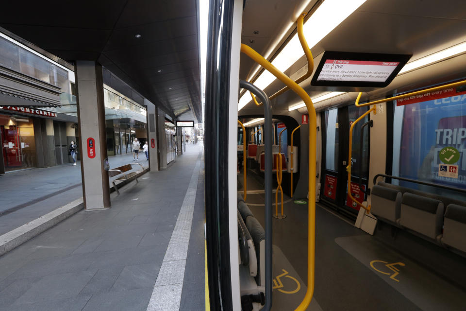 A tram and its platform are empty in Sydney on Aug. 13, 2021, as greater Sydney continues a weeks-long COVID-19 lockdown. Japan, Australia and New Zealand all got through the first year of the coronavirus pandemic in relatively good shape, but now are taking very divergent paths in dealing with new outbreaks of the fast-spreading delta variant. (AP Photo/Rick Rycroft)