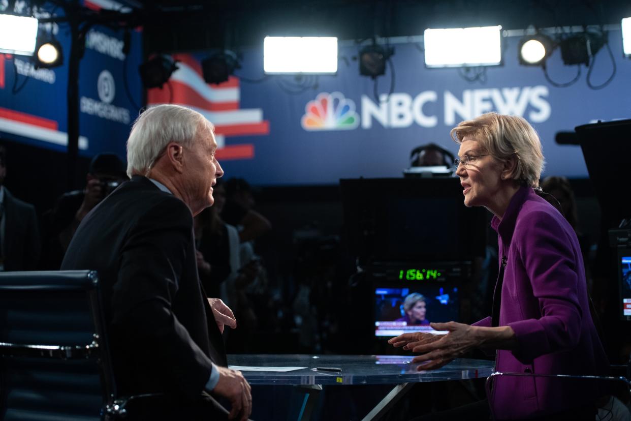 Democratic presidential hopeful US Senator from Massachusetts Elizabeth Warren with NBC anchor Chris Matthews in the Spin Room after participating in the first Democratic primary debate of the 2020 presidential campaign season hosted by NBC News at the Adrienne Arsht Center for the Performing Arts in Miami, Florida, June 26, 2019. (Photo by SAUL LOEB / AFP)        (Photo credit should read SAUL LOEB/AFP/Getty Images)