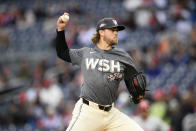 Washington Nationals pitcher Jake Irvin throws during the second inning of a baseball game against the Philadelphia Phillies, Saturday, April 6, 2024, in Washington. (AP Photo/Nick Wass)