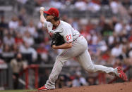 Philadelphia Phillies pitcher Aaron Nola works against the Atlanta Braves during the first inning of a baseball game Sunday, May 9, 2021, in Atlanta. (AP Photo/Ben Margot)