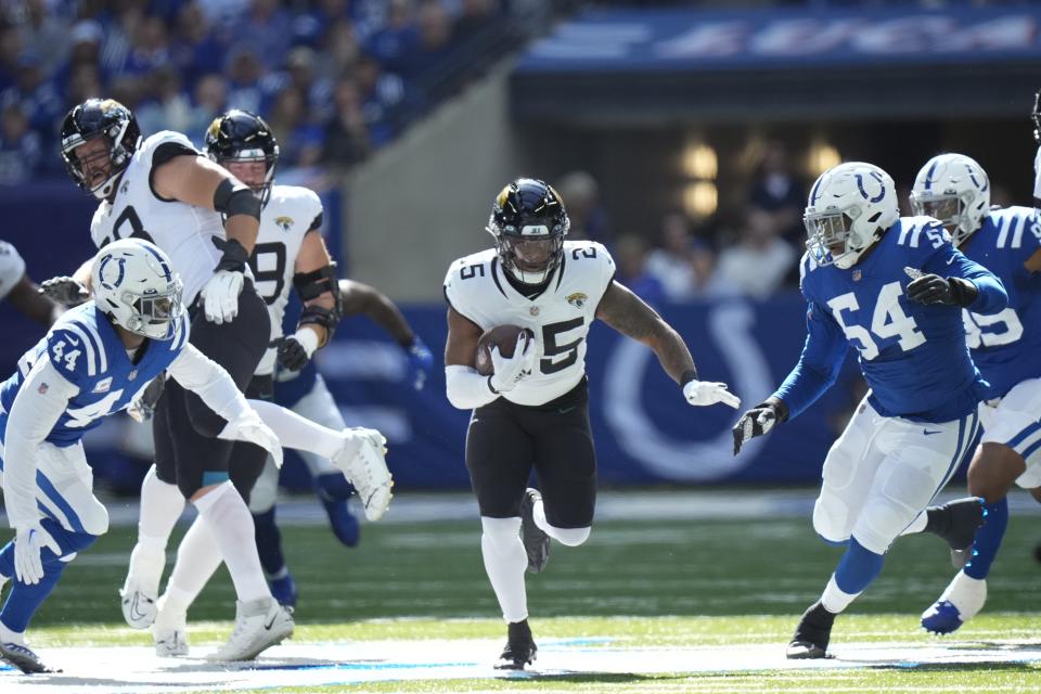 Jacksonville Jaguars running back James Robinson (25) runs during the first half of an NFL football game against the Indianapolis Colts, Sunday, Oct. 16, 2022, in Indianapolis.(AP Photo/AJ Mast)