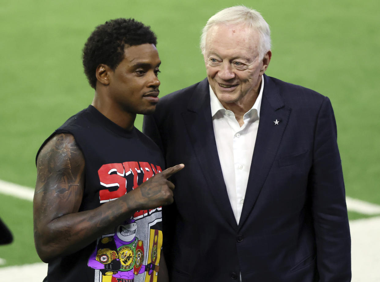 Boxer Errol Spence Jr., left, poses for a photo with Dallas Cowboys owner Jerry Jones during an NFL football practice, Tuesday, June 6, 2023, in Frisco, Texas. (AP Photo/Richard W. Rodriguez)