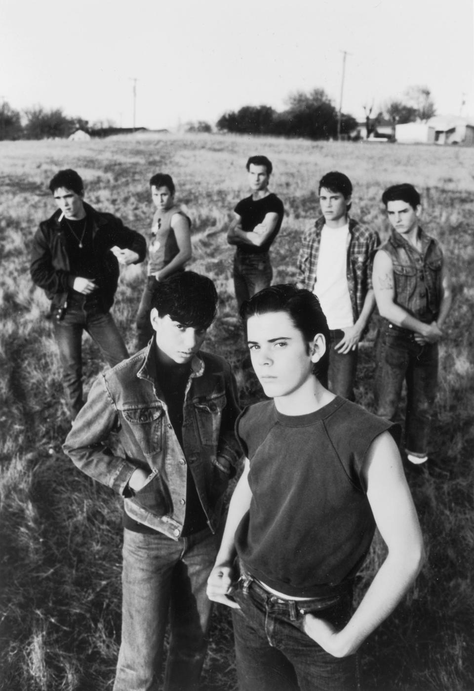 The cast of "The Outsiders" includes, from front to back,  C. Thomas Howell, Ralph Macchio, Matt Dillon, Emilio Estevez, Patrick Swayze Rob Lowe and Tom Cruise. Francis Ford Coppola filmed the 1983 movie, based on Oklahoma author S.E. Hinton's iconic book, in Tulsa.  A 4K restoration of "The Outsiders: The Complete Novel" is out Nov. 9 on a 4K UHD Collector’s Edition and on digital platforms.