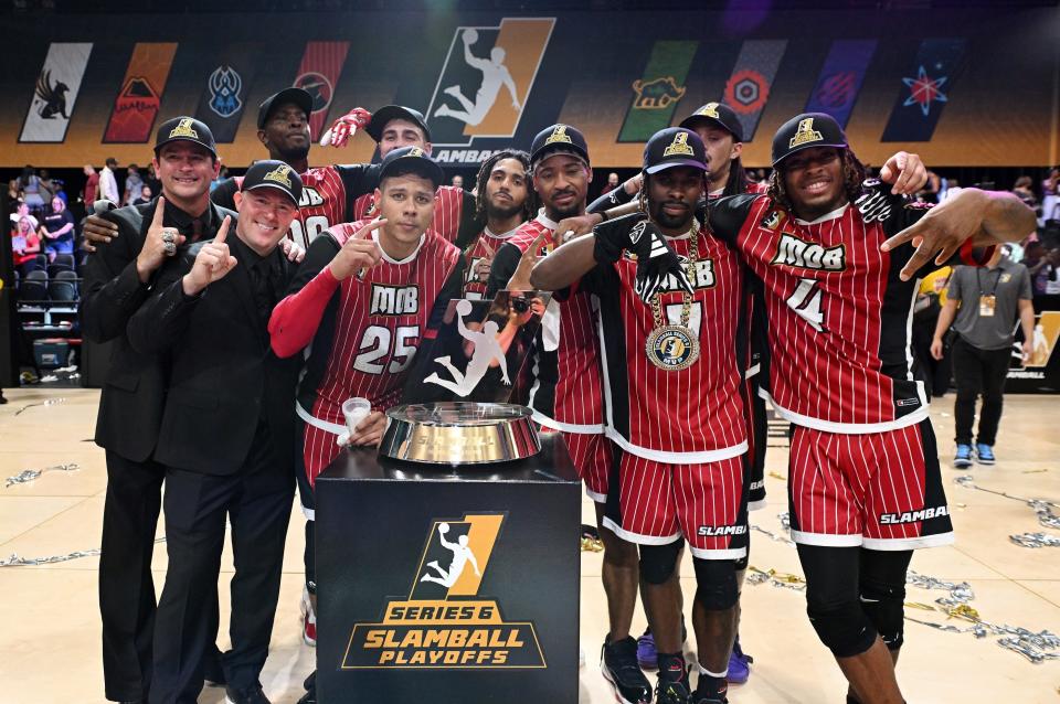 LAS VEGAS, NEVADA - AUGUST 17: Members of the Mob pose with the SlamBall Championship trophy after defeating the Slashers during the SlamBall championship game at the Cox Pavilion on August 17, 2023 in Las Vegas, Nevada. (Photo by Candice Ward/Getty Images for SlamBall)