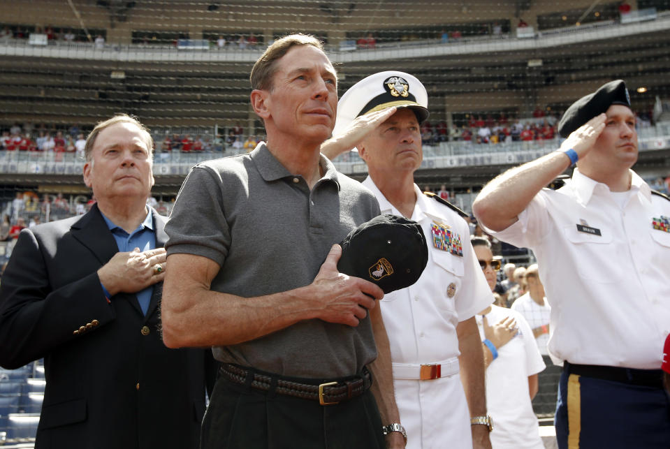 CIA Director David Petraeus, second from left, stands with Admiral James A. ìSandyî Winnefeld, Vice Chairman of the Joint Chiefs of Staff, second from right, before a baseball game between the Washington Nationals and the Miami Marlins at Nationals Park Sunday, Sept. 9, 2012, in Washington. (AP Photo/Alex Brandon)