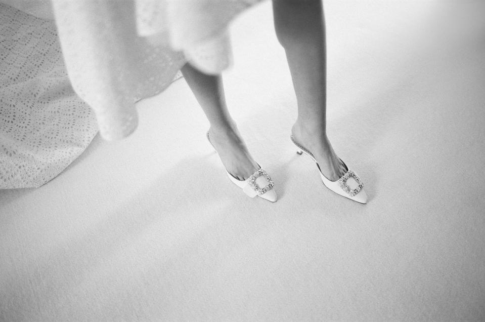 Happy feet! I found the perfect two-inch white satin slides from Manolo Blahnik.