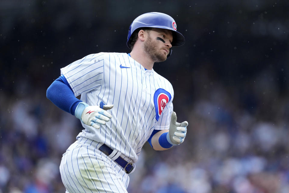 Chicago Cubs' Ian Happ rounds first on his home run off Atlanta Braves relief pitcher A.J. Minter during the seventh inning of a baseball game Saturday, Aug. 5, 2023, in Chicago. (AP Photo/Charles Rex Arbogast)