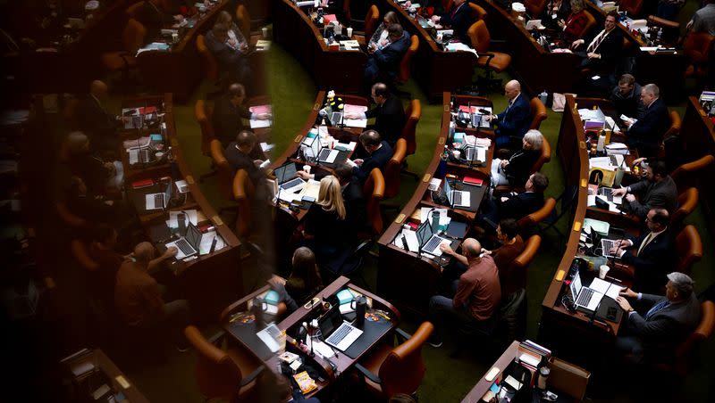 Lawmakers work in the House chamber at the Capitol in Salt Lake City on the last night of the 2023 legislative session on Friday, March 3, 2023.