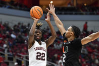 Louisville forward Kamari Lands (22) shoots over Miami guard Isaiah Wong (2) during the second half of an NCAA college basketball game in Louisville, Ky., Sunday, Dec. 4, 2022. Miami won 80-53. (AP Photo/Timothy D. Easley)