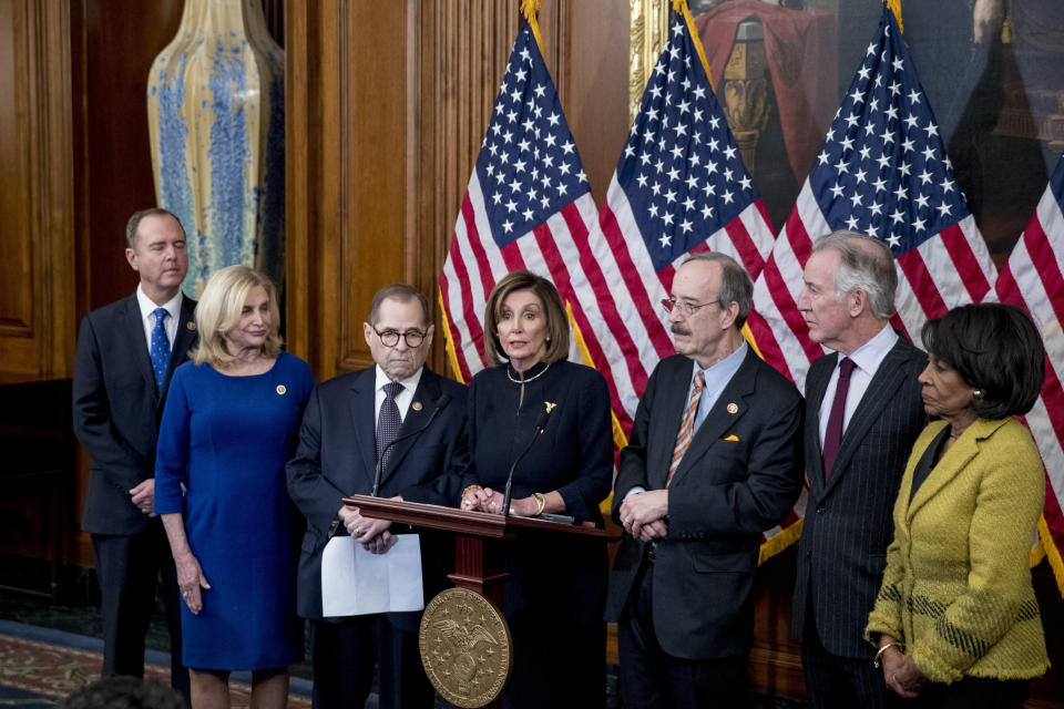 House Speaker Nancy Pelosi of Calif., center, accompanied by from left, House Intelligence Committee Chairman Adam Schiff, D-Calif., House Committee on Oversight and Reform Chairwoman Carolyn Maloney, D-N.Y., House Judiciary Committee Chairman Jerrold Nadler, D-N.Y., House Foreign Affairs Committee Chairman Eliot Engel, D-N.Y., House Ways and Means Committee Chairman Richard Neal, D-Mass., and House Financial Services Committee Chairwoman Maxine Waters, D-Calif., speaks at a news conference after the House votes to impeach President Donald Trump, Wednesday, Dec. 18, 2019, on Capitol Hill in Washington. (AP Photo/Andrew Harnik)