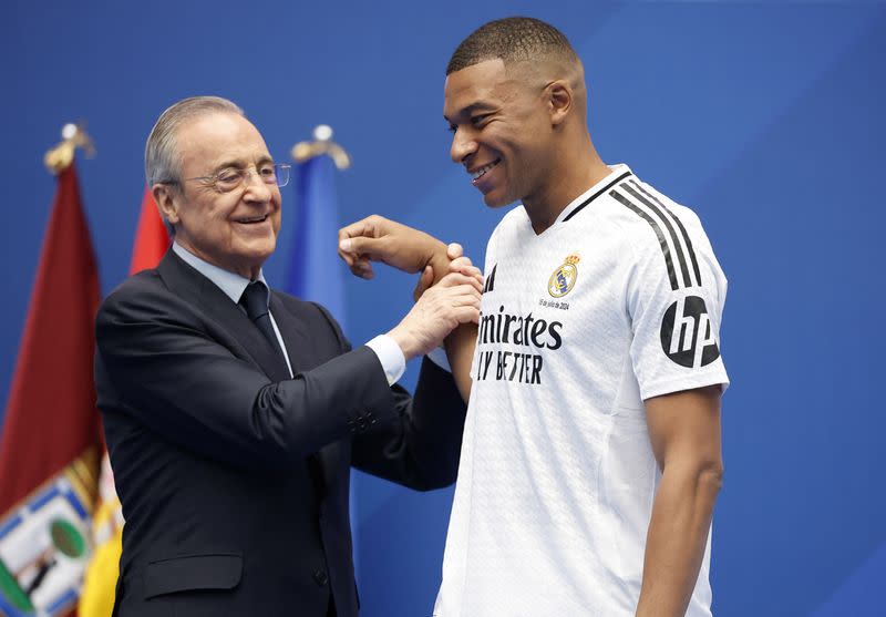 Kylian Mbappe with club president Florentino Perez during the presentation