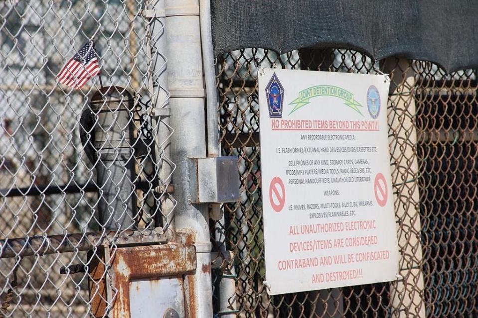 A US national flag is placed in the fencing of Camp 5 at the US Military's Prison in Guantanamo Bay, Cuba on January 26, 2017. (Photo credit THOMAS WATKINS/AFP via Getty Images)