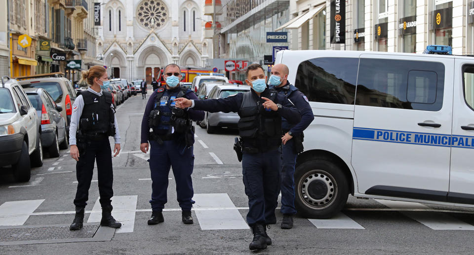 French policemen stand guard the street leading to the Basilica of Notre-Dame de Nice after a knife attack in Nice on October 29, 2020. - France's national anti-terror prosecutors said Thursday they have opened a murder inquiry after a man killed three people at a basilica in central Nice and wounded several others. The city's mayor, Christian Estrosi, told journalists at the scene that the assailant, detained shortly afterwards by police, "kept repeating 'Allahu Akbar' (God is Greater) even while under medication." He added that President Emmanuel Macron would be arriving shortly in Nice. (Photo by Valery HACHE / AFP) (Photo by VALERY HACHE/AFP via Getty Images)