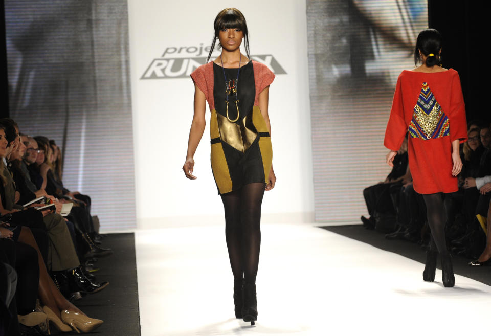 Fashion by the finalists of "The Project Runway" fashion competition series is modeled during Fashion Week, Friday Feb. 8, 2013, in New York. (AP Photo/Louis Lanzano)