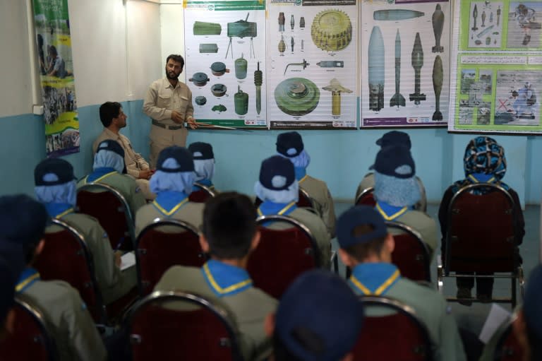 Afghan Scouts listen to a deminer as they attend a class at the Scouts training centre in Kabul