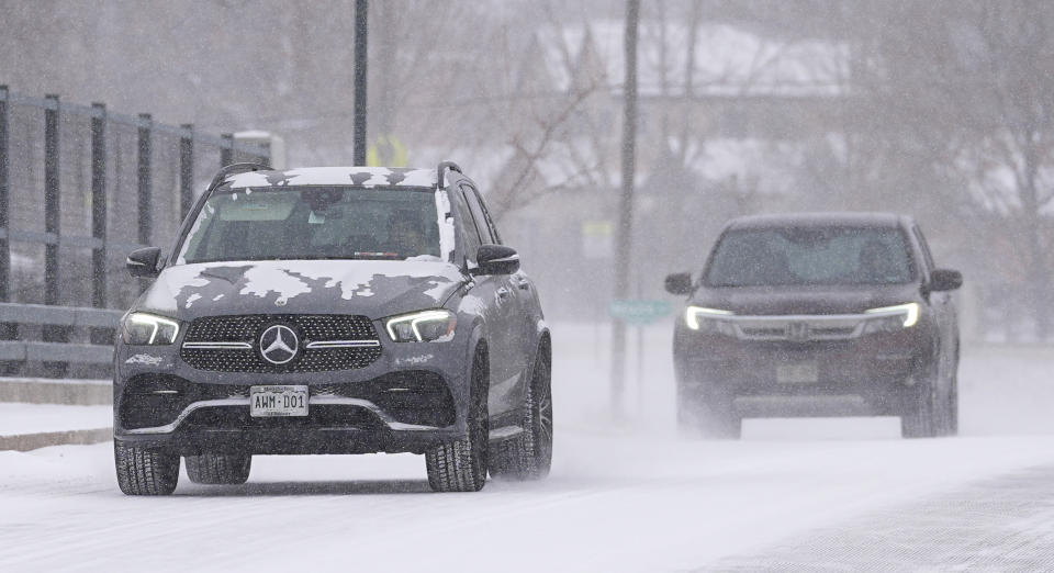 With the daytime high temperature below zero, motorists guide sports-utility vehicles across the Steele Street overpass over Interstate 25 Monday, Jan. 15, 2024, in Denver. Forecasters predict that the frigid weather will persist until midweek in the intermountain West. (AP Photo/David Zalubowski)