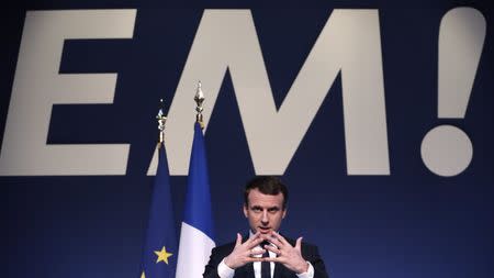 Emmanuel Macron, head of the political movement En Marche !, or Onwards !, and candidate for the 2017 French presidential election, speaks during a news conference to unveil his fully budgeted manifesto, named a "contract with the nation", in Paris, France, March 2, 2017. REUTERS/Christian Hartmann