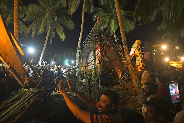 P.P. Afthab/AP Photo Rescuers pulling tourist boat ashore