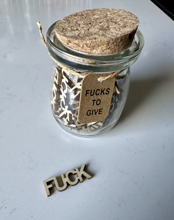 a jar with the label "fucks to give"
