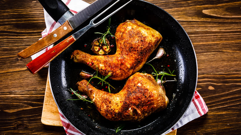 chicken legs in cast-iron skillet