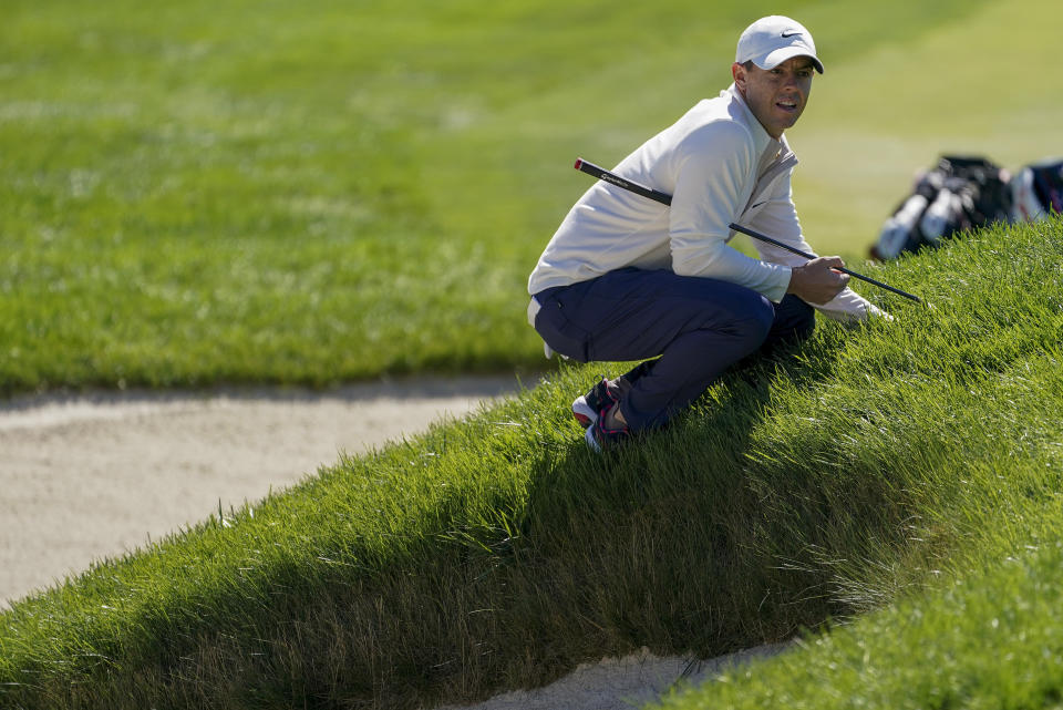 Rory McIlroy, of Northern Ireland, lines up a putt on the first green during the third round of the US Open Golf Championship, Saturday, Sept. 19, 2020, in Mamaroneck, N.Y. (AP Photo/John Minchillo)