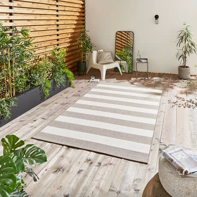 Create a homely seating set-up with a waterproof outdoor rug