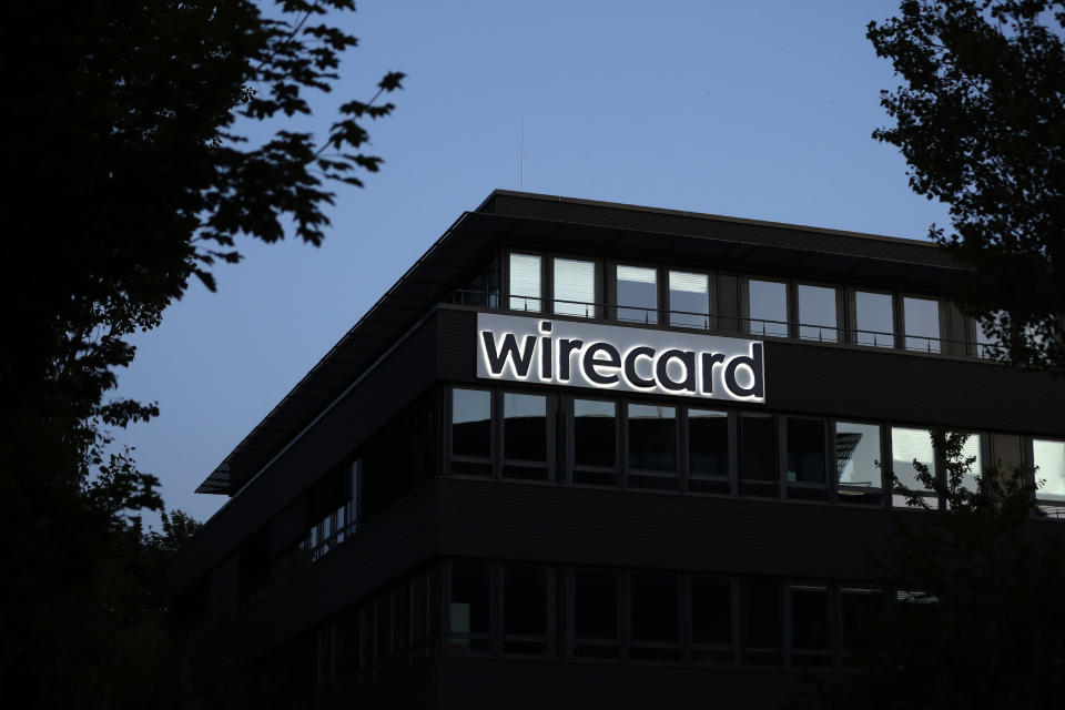 FILE - In this July 20, 2021 file photo, the logo of payment company Wirecard is pictured at the headquarters in Munich, Germany. German lawmakers say they plan to question Chancellor Angela Merkel and her deputy about their involvement with the collapsed payment systems provider Wirecard next month. (AP Photo/Matthias Schrader, File)