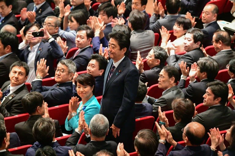 Shinzo Abe's victory in party elections effectively hands him three more years as Japan's prime minister