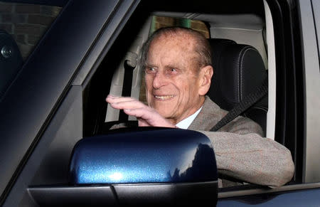 FILE PHOTO: Britain's Prince Philip is driven away from Papworth Hospital in southern England December 27, 2011. REUTERS/Neil Hall/File Photo