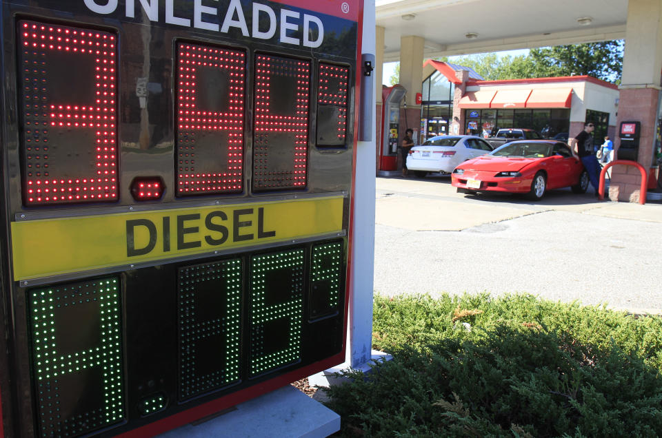 A man fills his gas tank at a gas station Wednesday, Aug. 29, 2012, in South Euclid, Ohio. Drivers are facing the biggest one-day jump in gasoline prices in 18 months as Hurricane Isaac swamps the nation’s oil and gas hub along the Gulf Coast. Some states in the Midwest suffered even more dramatic spikes. Ohio prices jumped 14 cents, Indiana prices jumped 13 cents and Illinois prices jumped 10 cents according to the Oil Price Information Service. (AP Photo/Tony Dejak)