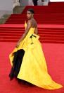 <p>Lashana Lynch, who plays the first Black female 007, wore a yellow Vivienne Westwood gown with Ara Vartanian jewellery.</p>