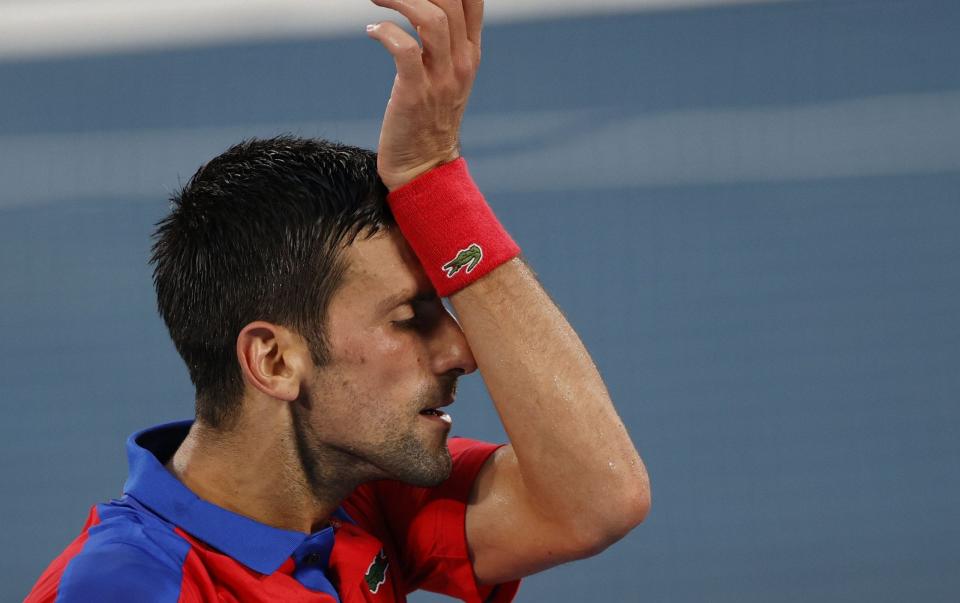 Novak Djokovic of Serbia reacts during the Men's Singles Semifinal against Alexander Zverev of Germany at the Tennis events of the Tokyo 2020 Olympic Games at the Ariake Coliseum in Tokyo, Japan, 30 July 2021 - Shutterstock 