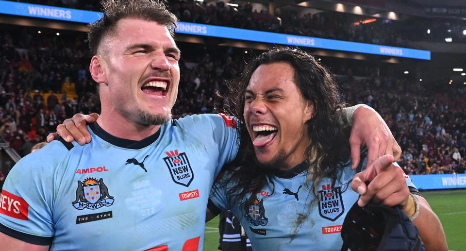 NSW teammates Angus Crichton and Jarome Luai are pictured celebrating together after the Blues beat Queensland in Game 3 to clinch the State of Origin series. Pic: Getty 