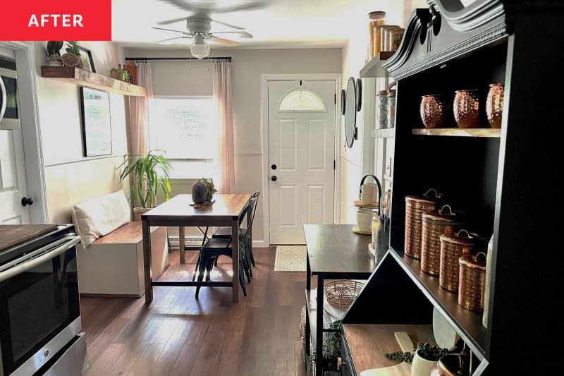 Newly renovated farm kitchen with wooden bench seating on one side of wooden rectangular dining table and aluminum chairs on the other side.