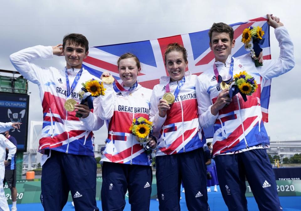 Alex Yee, Georgia Taylor-Brown, Jessica Learmonth and Jonny Brownlee cheer their victory (Danny Lawson / PA)