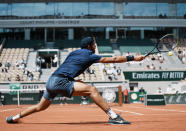 Russia's Karen Khachanov plays a return to Japan's Kei Nishikori during their second round match on day four of the French Open tennis tournament at Roland Garros in Paris, France, Wednesday, June 2, 2021. (AP Photo/Thibault Camus)