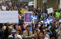 Demonstrators protest against Quebec's proposed Charter of Values in Montreal, September 14, 2013. Thousands took to the streets to denounce the province's proposed bill to ban the wearing of any overt religious garb by government paid employees. REUTERS/ Christinne Muschi(CANADA - Tags: POLITICS CIVIL UNREST RELIGION)