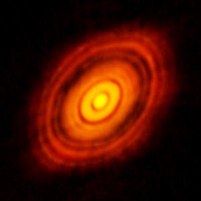 Rings of gas and dust rotating around a bright hot core.