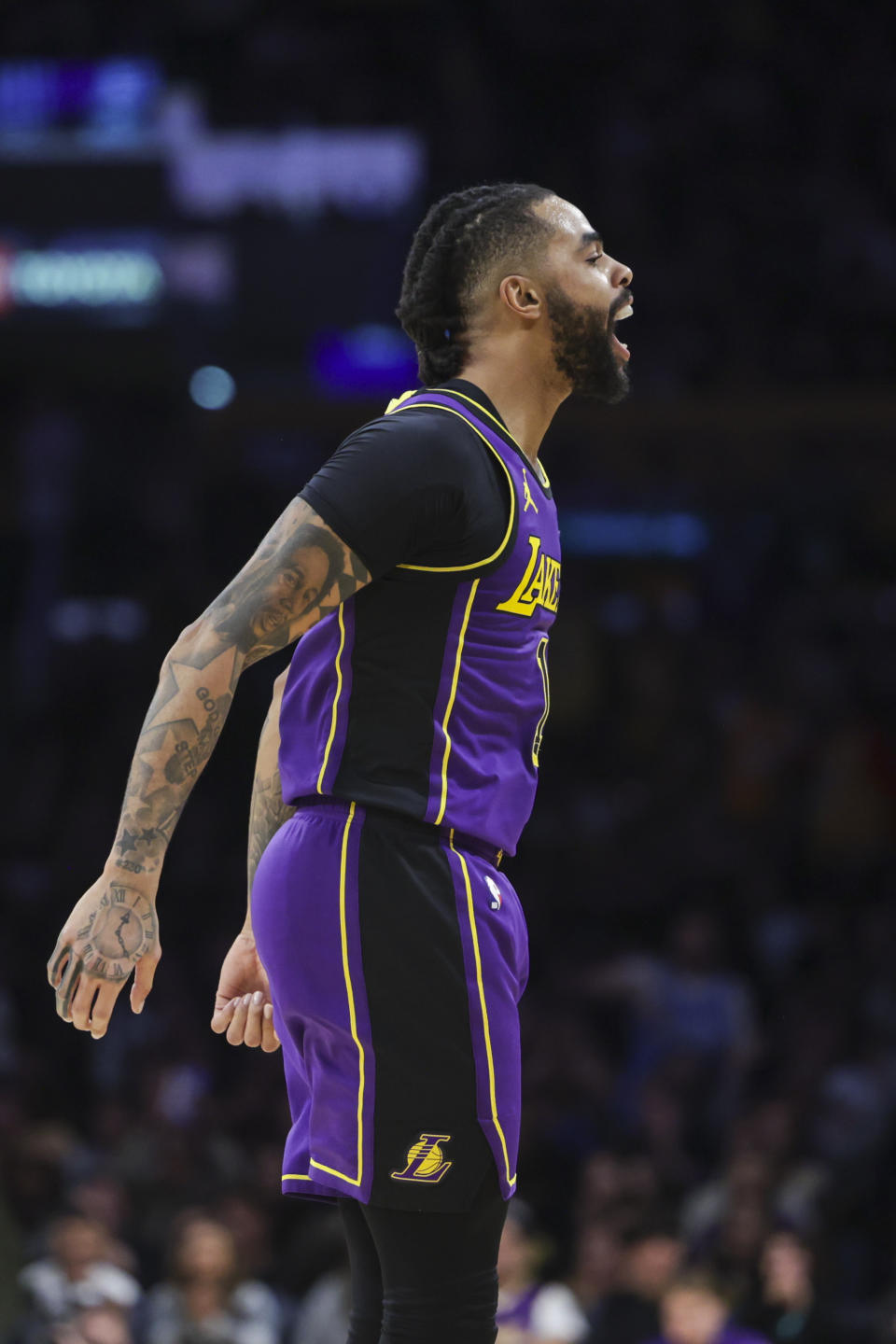 Los Angeles Lakers guard D'Angelo Russell (1) celebrates during the first half of the team's NBA basketball game against the New Orleans Pelicans on Friday, Feb. 9, 2024, in Los Angeles. (AP Photo/Yannick Peterhans)