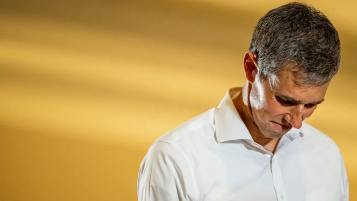 Texas gubernatorial candidate Beto O'Rourke bows his head.