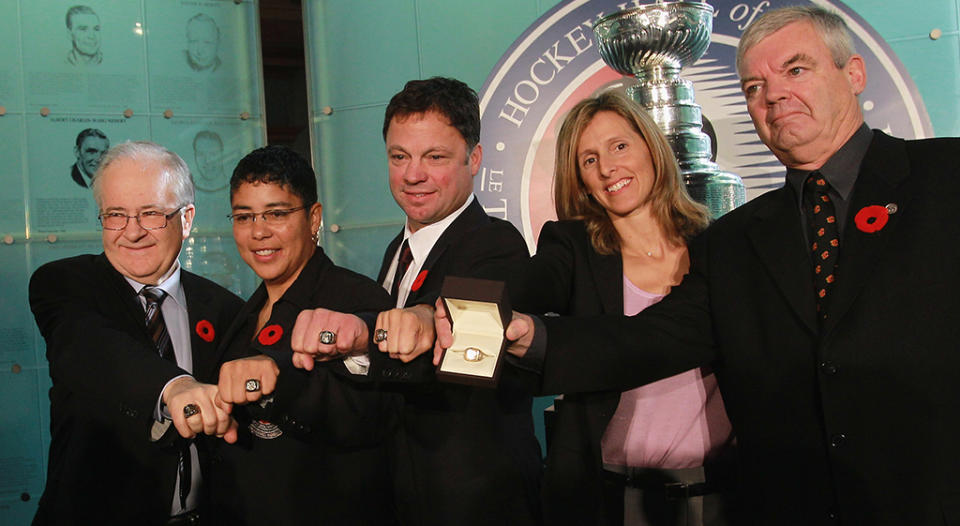 Cammi Granato (second left) became the first women ever inducted into the Hockey Hall of Fame in 2010. (Getty Images)