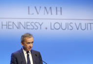 FILE - In this Jan.25, 2018 file photo, CEO of LVMH Bernard Arnault presents the group's 2017 results in Paris, France. The billionaire French donors including Bernard Arnault, CEO of luxury giant LVMH that owns Louis Vuitton and Dior, publicly promised flashy donations, but it's mainly American citizens that have footed the bills and paid salaries for the up to 150 workers employed by the cathedral since the April 15 fire. (AP Photos/Michel Euler, File)