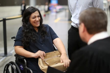 Tatev, who is from Armenia and has lived in the U.S. for 17 years and Judge Cormac J. Carney are seen during a quick impromptu naturalization ceremony before the official event in Los Angeles