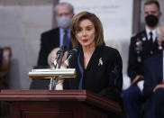 House Speaker Nancy Pelosi of Calif., speaks near the casket of former Sen. Bob Dole, who died on Sunday, during a congressional ceremony to honor Dole, who lies in state in the U.S. Capitol Rotunda in Washington, Thursday, Dec. 9, 2021. (Jonathan Ernst/Pool via AP)