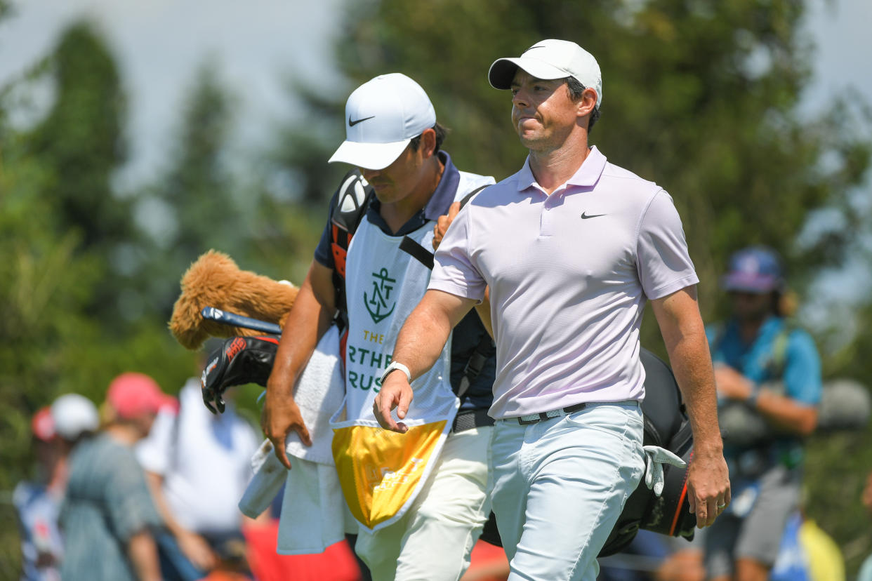 JERSEY CITY, NJ - AUGUST 09: Rory McIlroy of Northern Ireland and his caddie walk off the fifth tee box during the second round of THE NORTHERN TRUST at Liberty National Golf Club on August 9, 2019 in Jersey City, New Jersey. (Photo by Ben Jared/PGA TOUR via Getty Images)